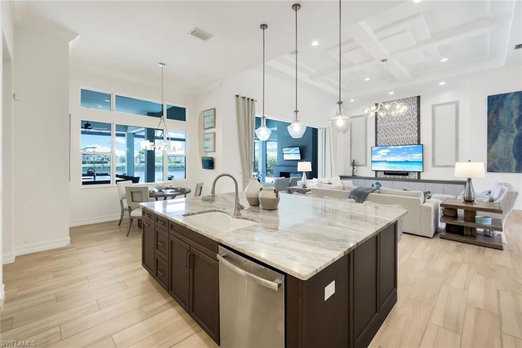 6259 Lightbourn Way Naples, FL 34113 - Photo 18 of 23 Gourmet kitchen with full storage in the island and seating for four