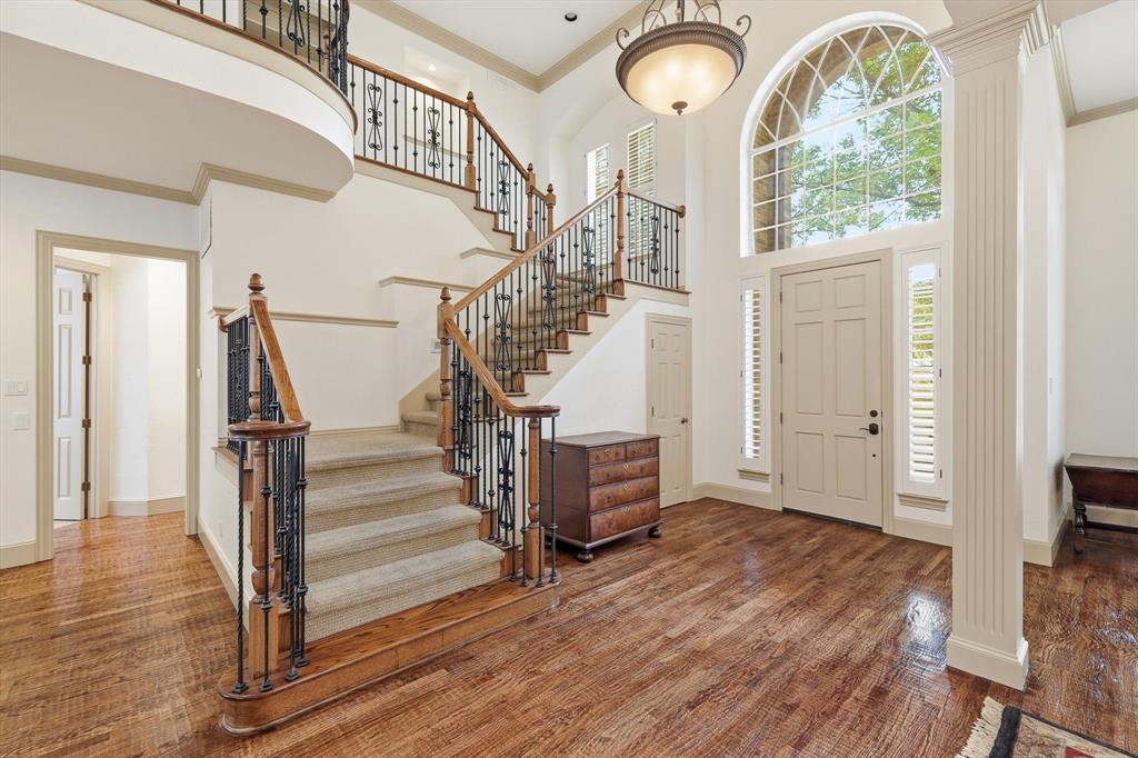 117 Portside Lane Coppell, TX 75019 - Photo 4 of 37 Striking open design showcases the home’s elegant staircase, elevated architectural details, and refined sense of space.