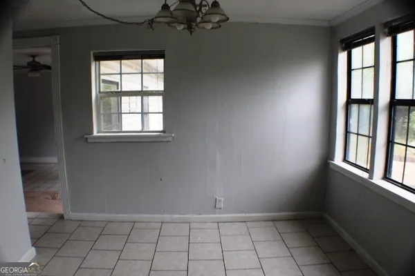 an empty room with windows