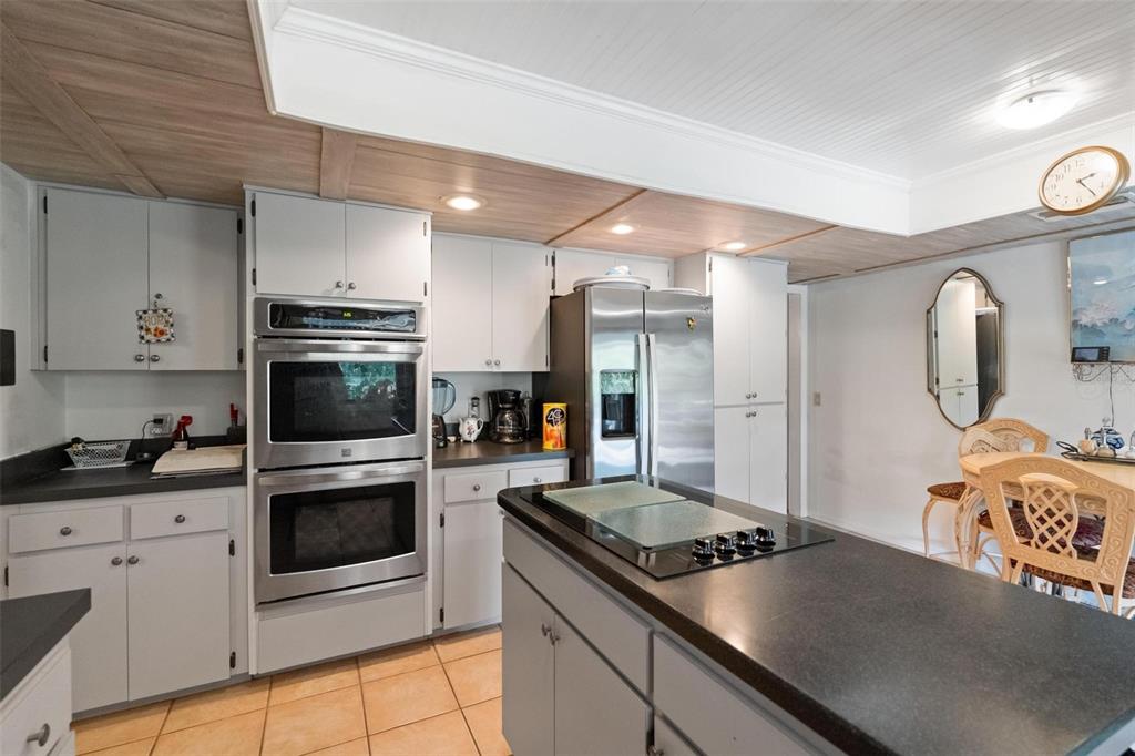 1245 Curlew Road Dunedin, FL 34698 - Photo 12 of 42 a kitchen with a stove and a sink