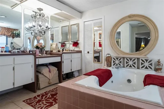 a bathroom with a granite countertop sink a mirror and vanity