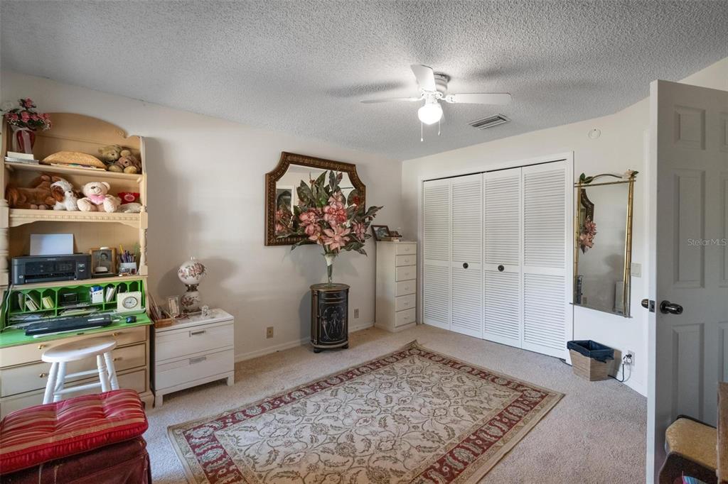 1245 Curlew Road Dunedin, FL 34698 - Photo 22 of 42 a living room with furniture and a rug