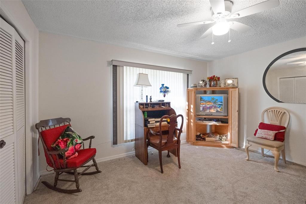 1245 Curlew Road Dunedin, FL 34698 - Photo 24 of 42 a room with furniture and musical instruments