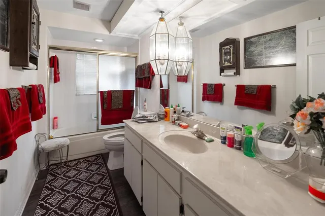 a bathroom with a sink vanity and mirror