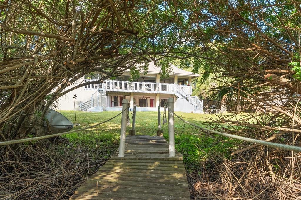1245 Curlew Road Dunedin, FL 34698 - Photo 38 of 42 a front view of a house with a yard