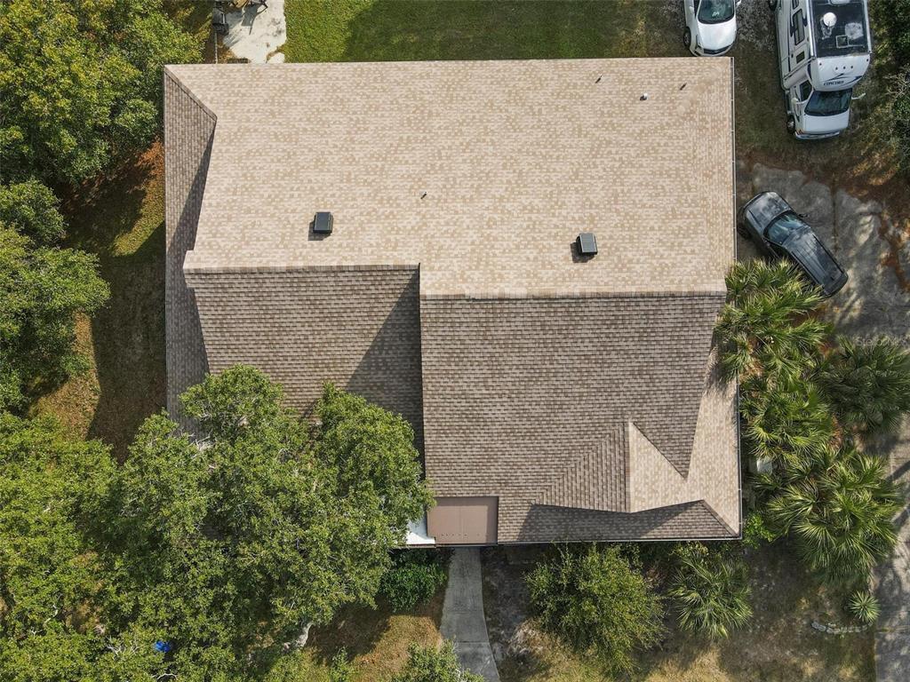 1245 Curlew Road Dunedin, FL 34698 - Photo 42 of 42 front view of a house with a yard