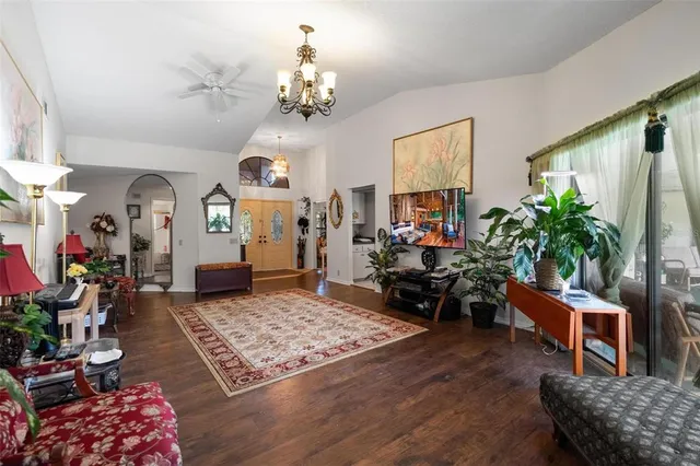 a living room with furniture rug and window
