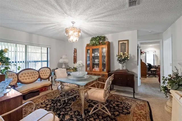 a view of a livingroom with furniture and windows