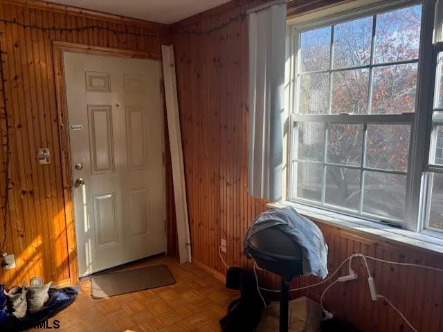 a view of a livingroom with furniture and windows