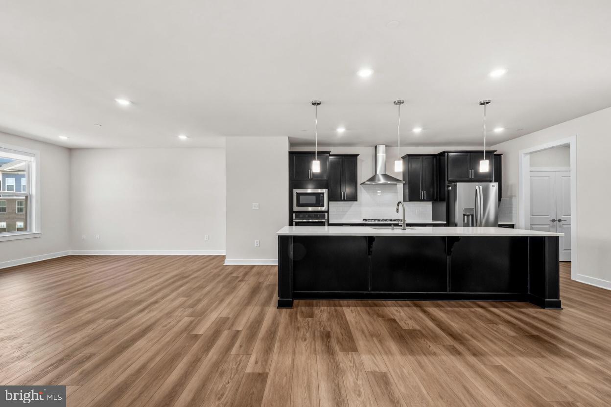 103 Brown Branch Road Laurel, MD 20708 - Photo 22 of 56 Kitchen/Dining/Living AI Unstaged