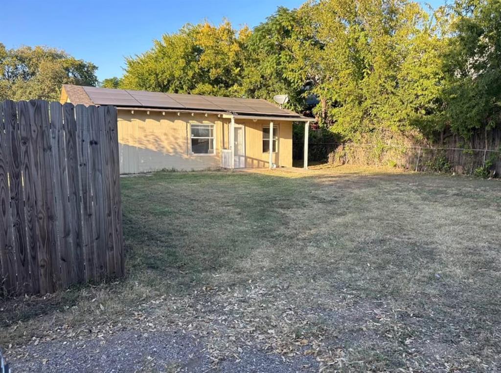 Undisclosed Address Lake Worth, TX 76135 - Photo 1 of 1 a front view of house with small garden