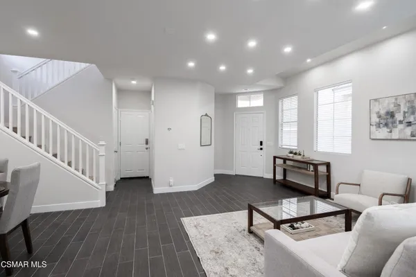 a bathroom with a sink toilet and a mirror