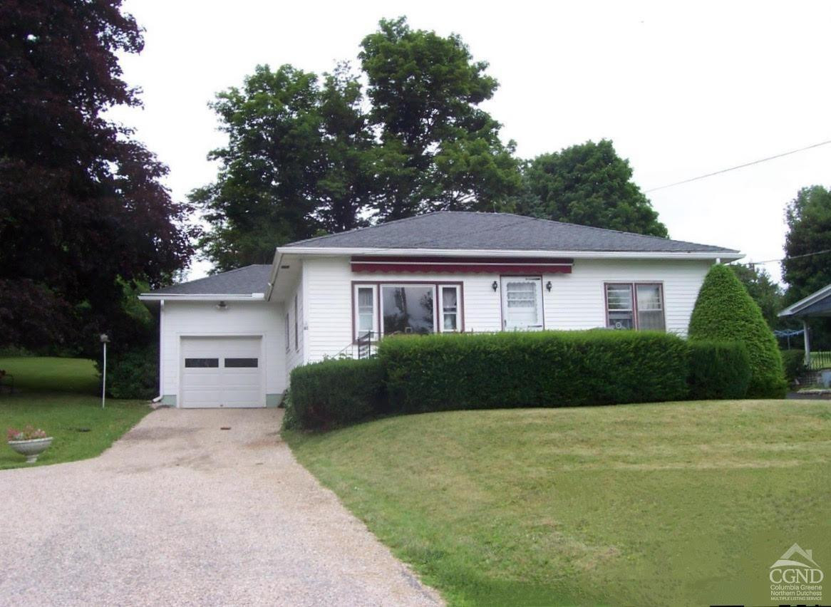 81 Rudd Pond Road Millerton, NY 12546 - Photo 1 of 23 a front view of a house with a yard