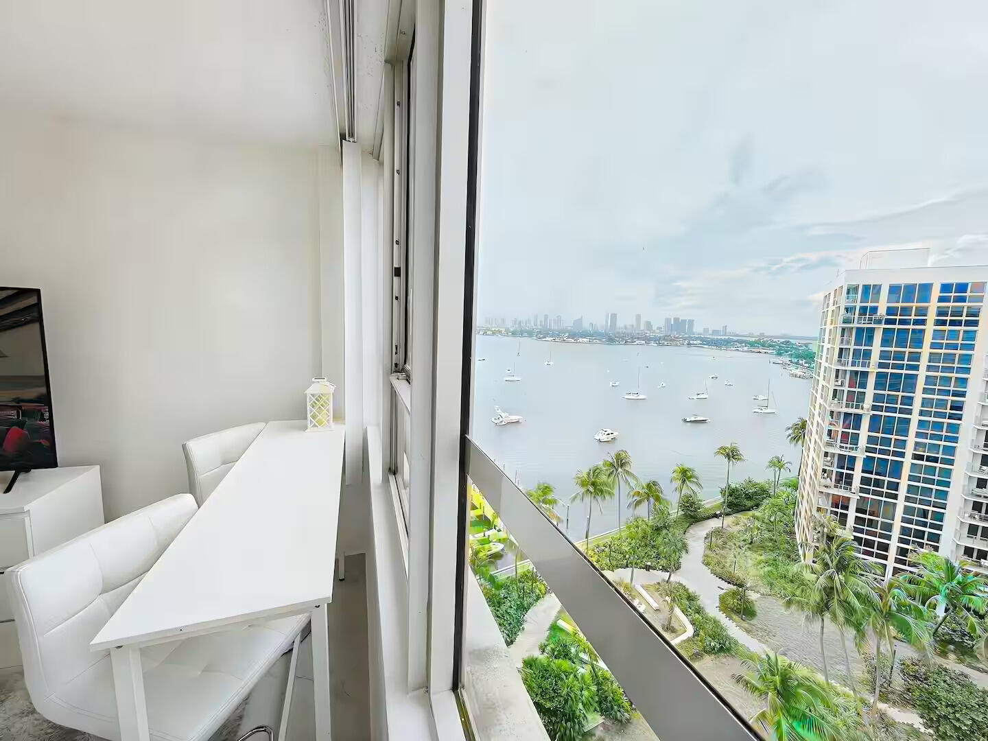 1500 Bay Road, Unit 1244S Miami Beach, FL 33139 - Photo 17 of 48 a balcony with table and chairs