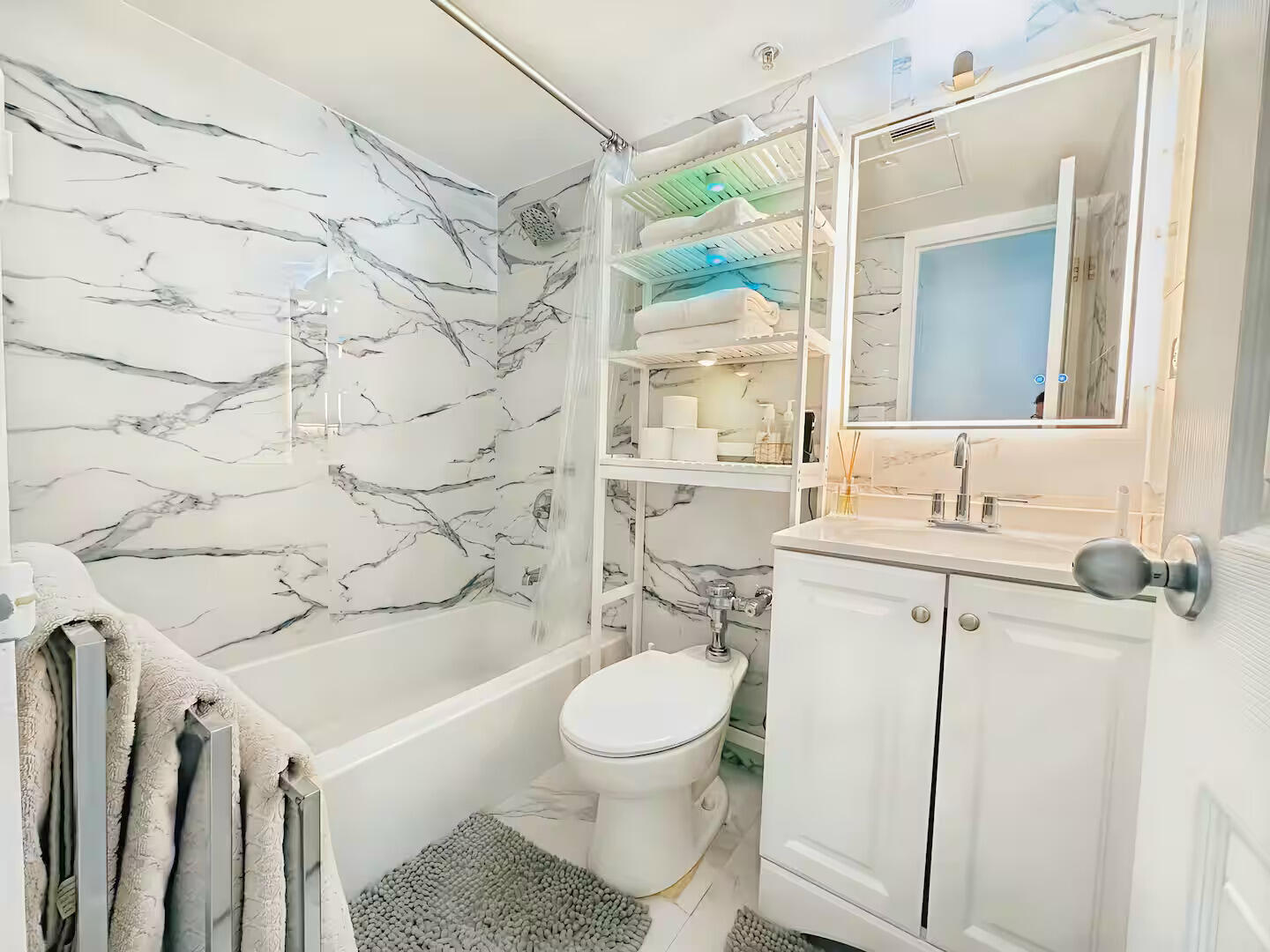 1500 Bay Road, Unit 1244S Miami Beach, FL 33139 - Photo 19 of 48 a bathroom with a sink toilet and shower