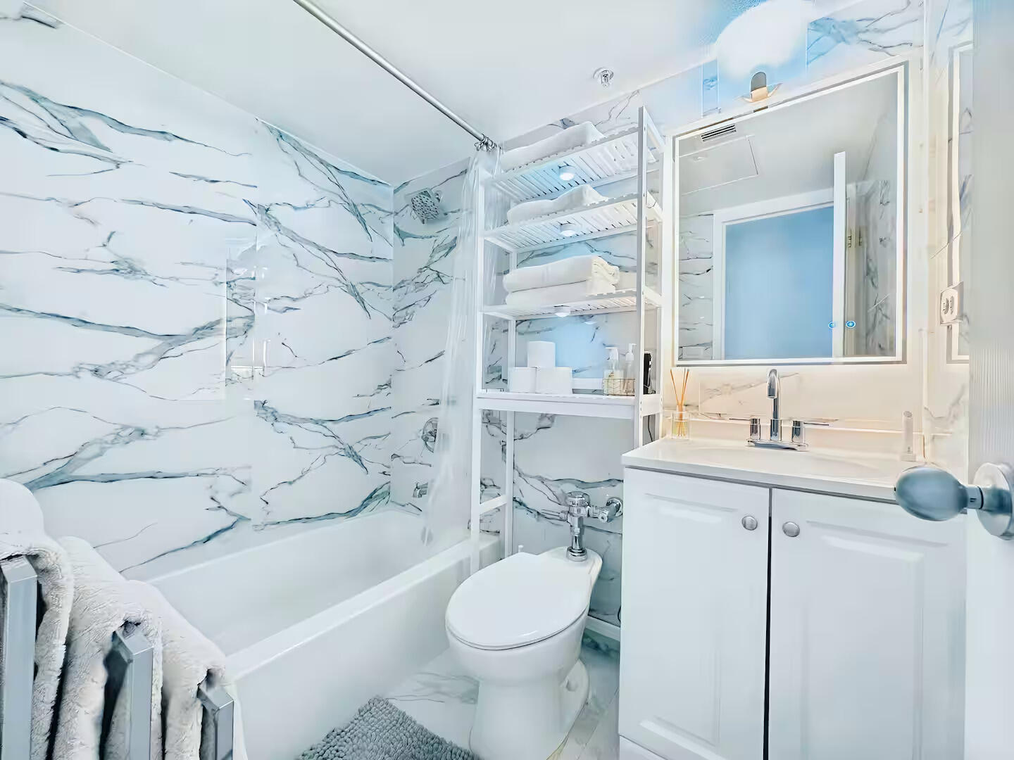 1500 Bay Road, Unit 1244S Miami Beach, FL 33139 - Photo 20 of 48 a bathroom with a sink toilet vanity and shower