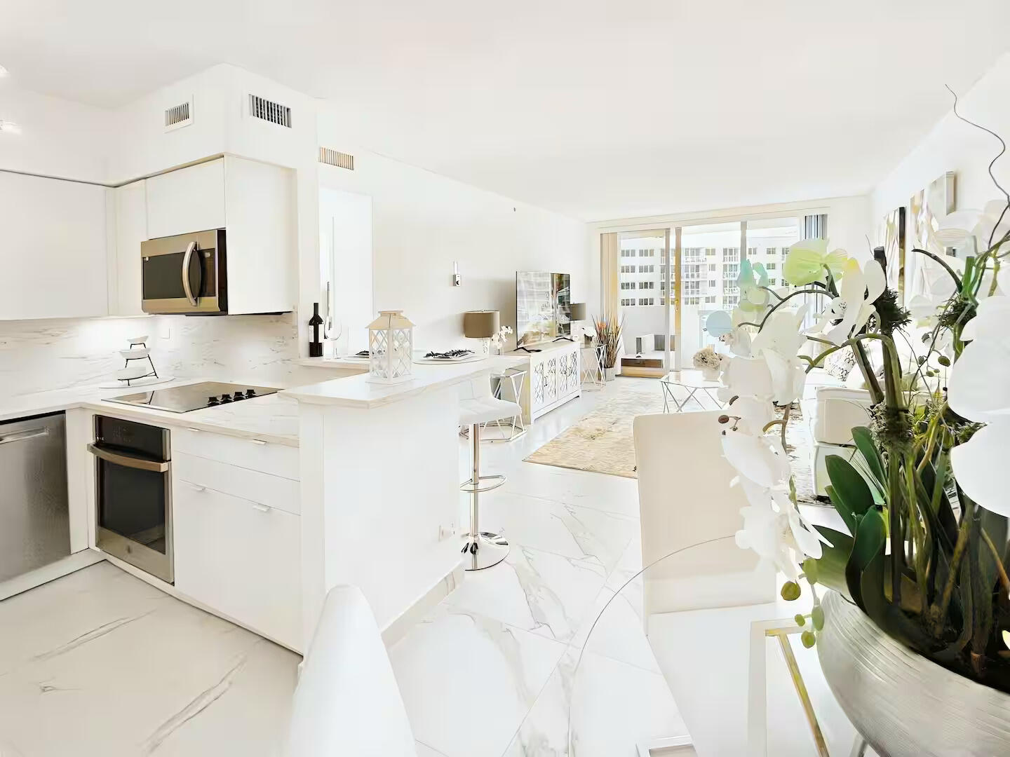 1500 Bay Road, Unit 1244S Miami Beach, FL 33139 - Photo 3 of 48 a living room with stainless steel appliances kitchen island furniture and a fireplace