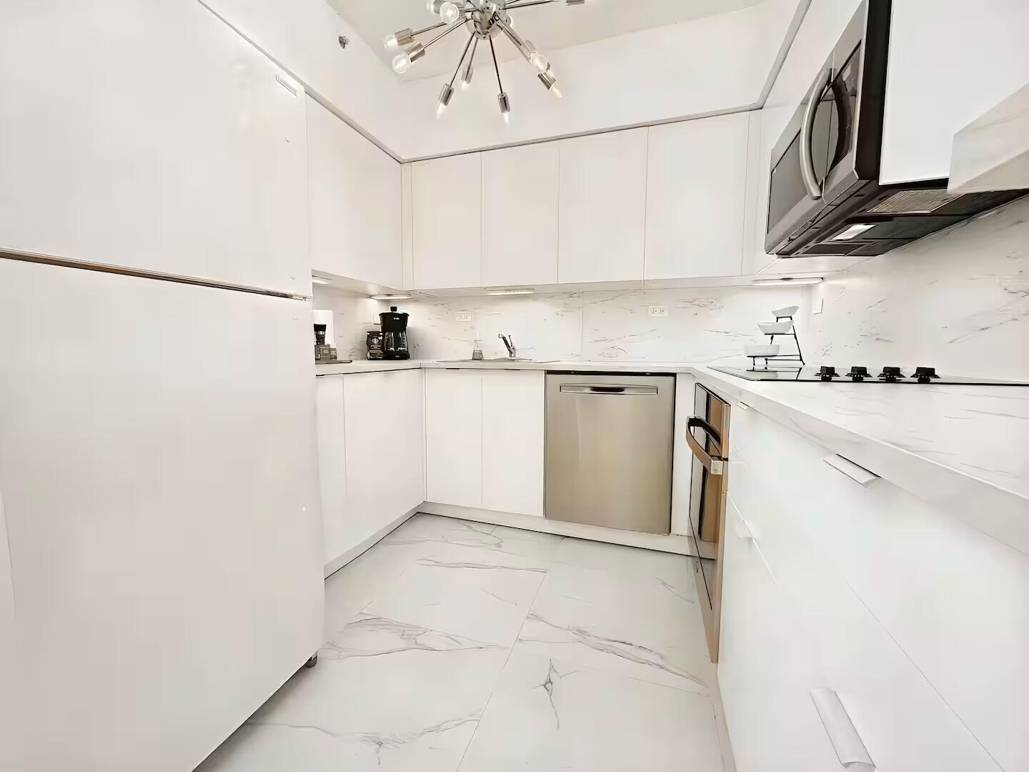 1500 Bay Road, Unit 1244S Miami Beach, FL 33139 - Photo 4 of 48 a utility room with cabinets washer and dryer