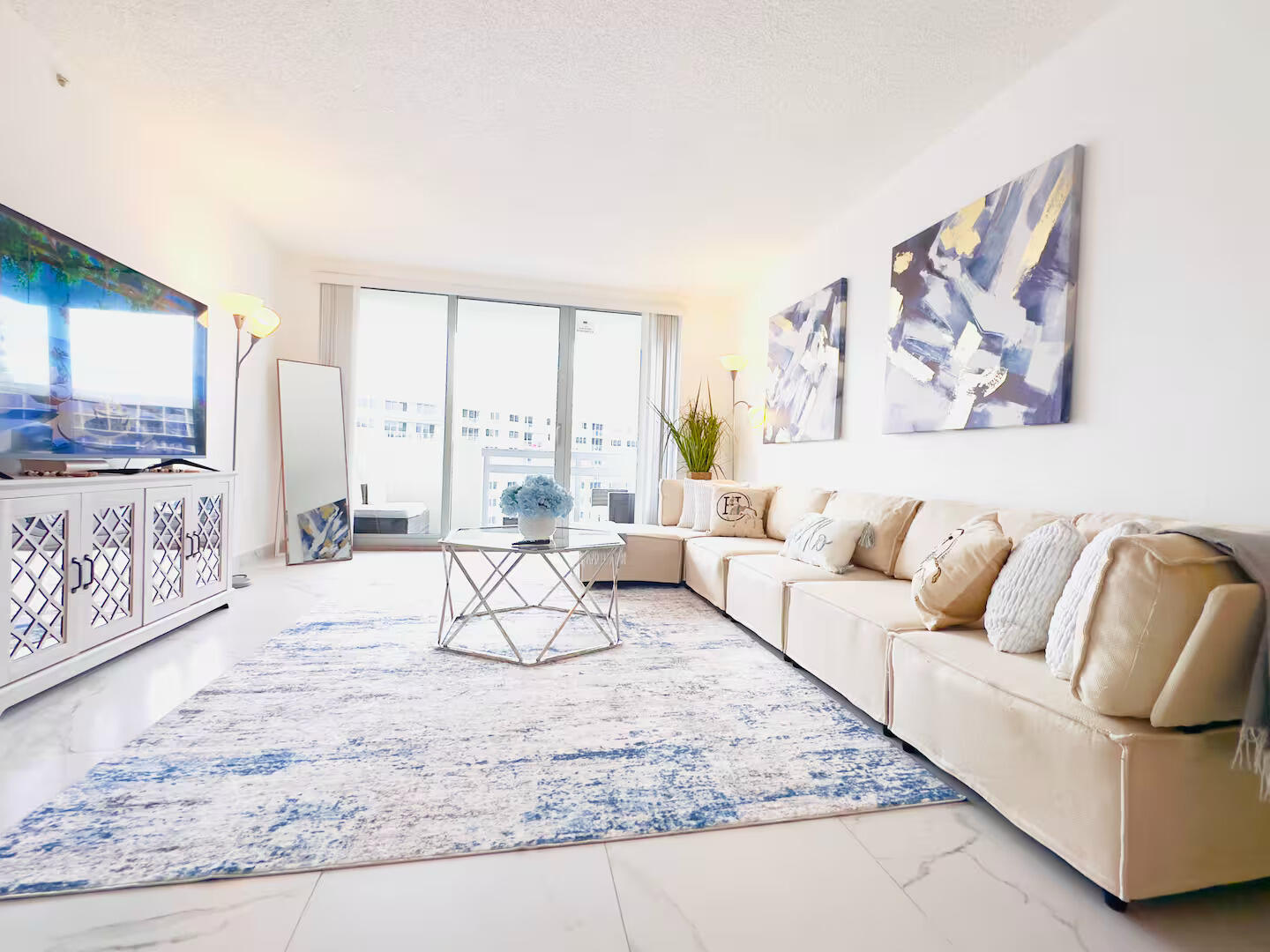 1500 Bay Road, Unit 1244S Miami Beach, FL 33139 - Photo 9 of 48 a living room with furniture and a large window