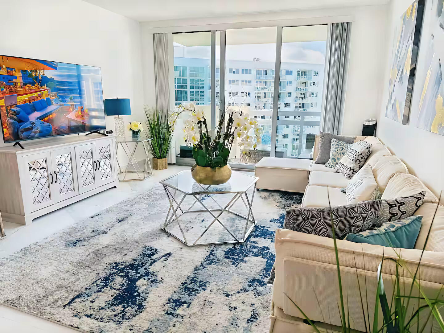 1500 Bay Road, Unit 1244S Miami Beach, FL 33139 - Photo 10 of 48 a living room with furniture and flat screen tv