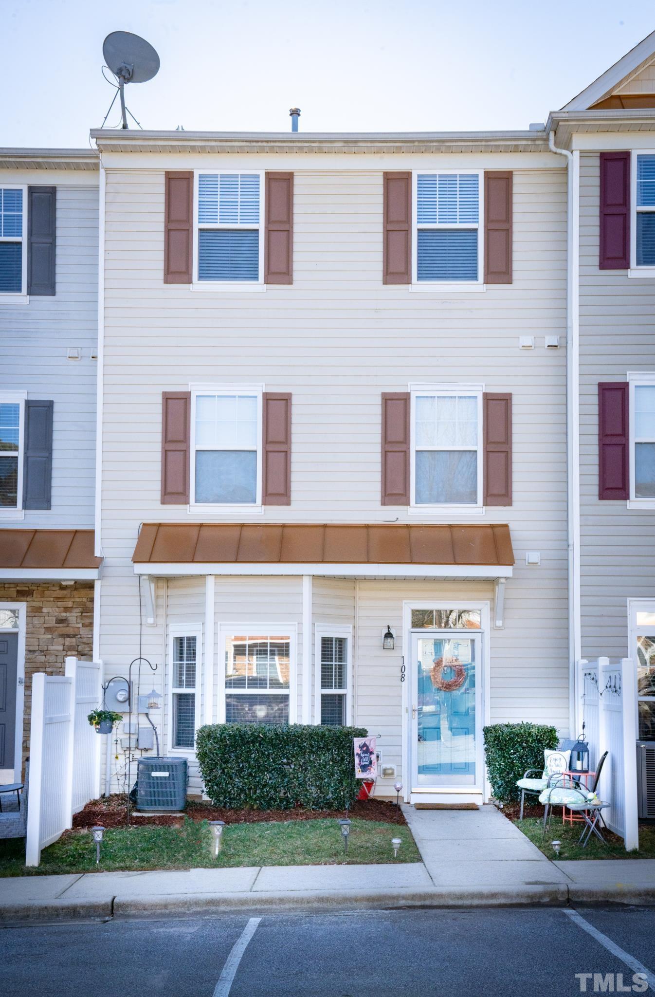 a front view of a building with garden