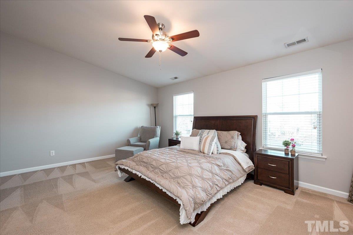 2210 Raven Road, Unit 108 Raleigh, NC 27614 - Photo 21 of 22 a bedroom with a bed and window
