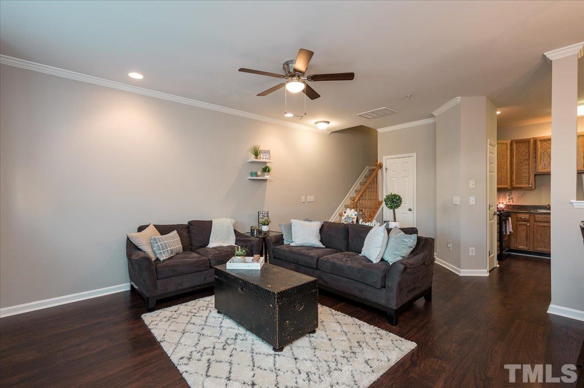 2210 Raven Road, Unit 108 Raleigh, NC 27614 - Photo 4 of 22 a living room with furniture and a wooden floor