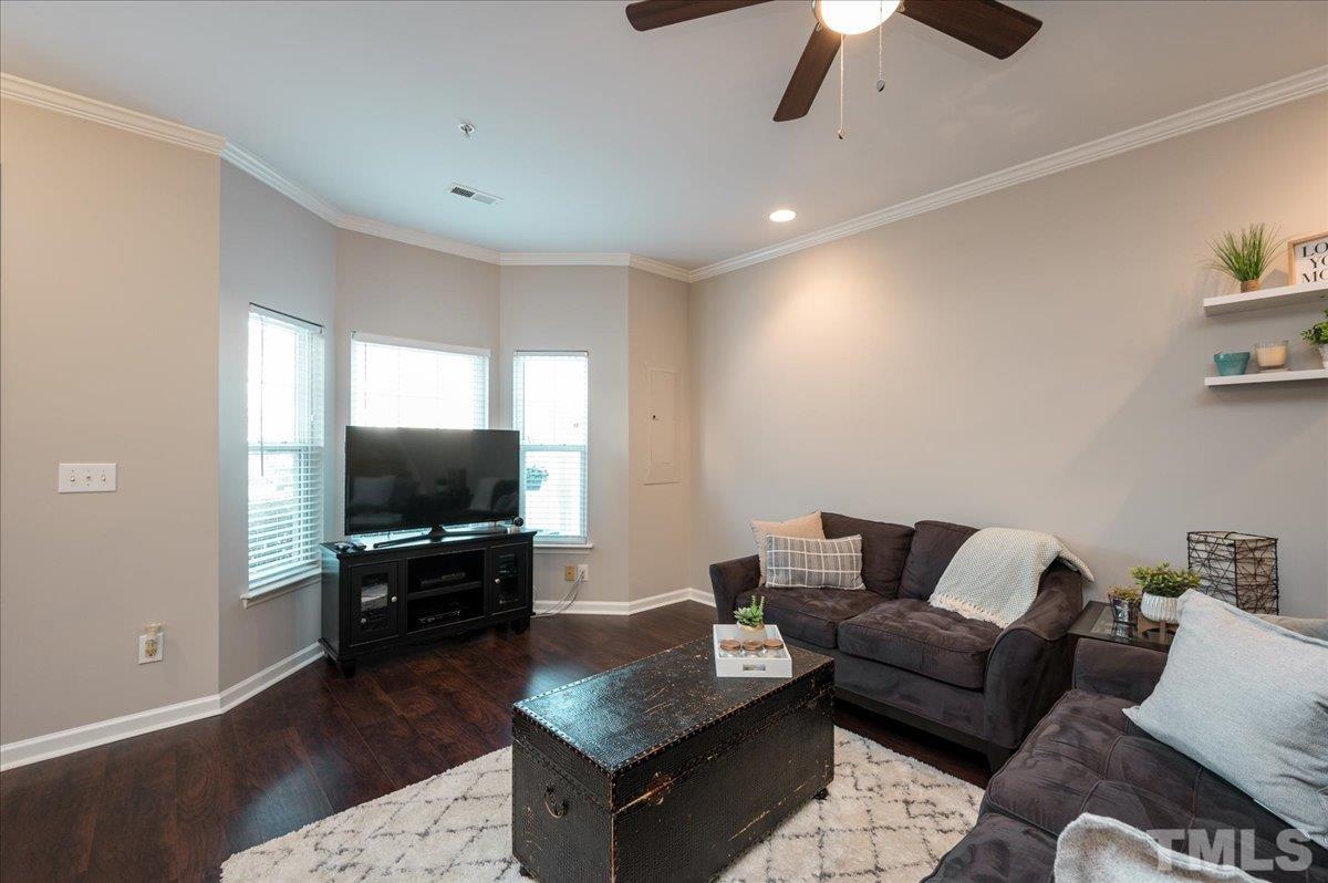 2210 Raven Road, Unit 108 Raleigh, NC 27614 - Photo 5 of 22 a living room with furniture and a flat screen tv