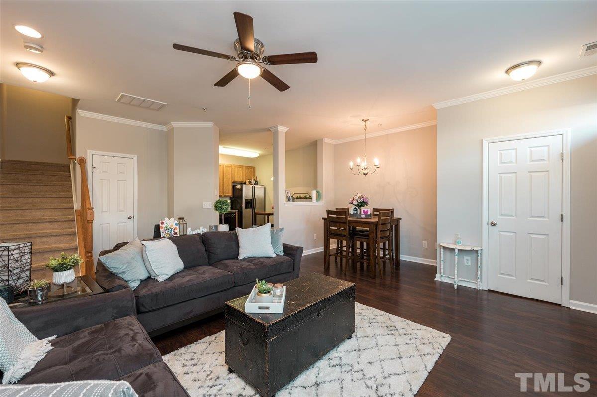 2210 Raven Road, Unit 108 Raleigh, NC 27614 - Photo 6 of 22 a living room with furniture and a wooden floor