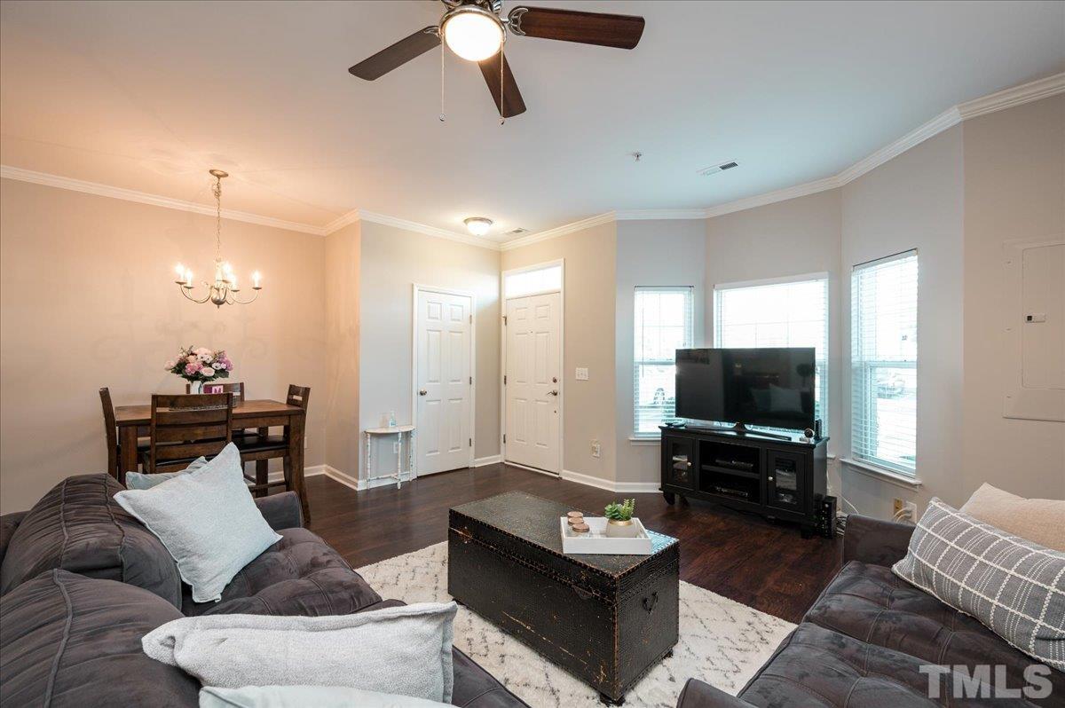 2210 Raven Road, Unit 108 Raleigh, NC 27614 - Photo 7 of 22 a living room with furniture and a flat screen tv