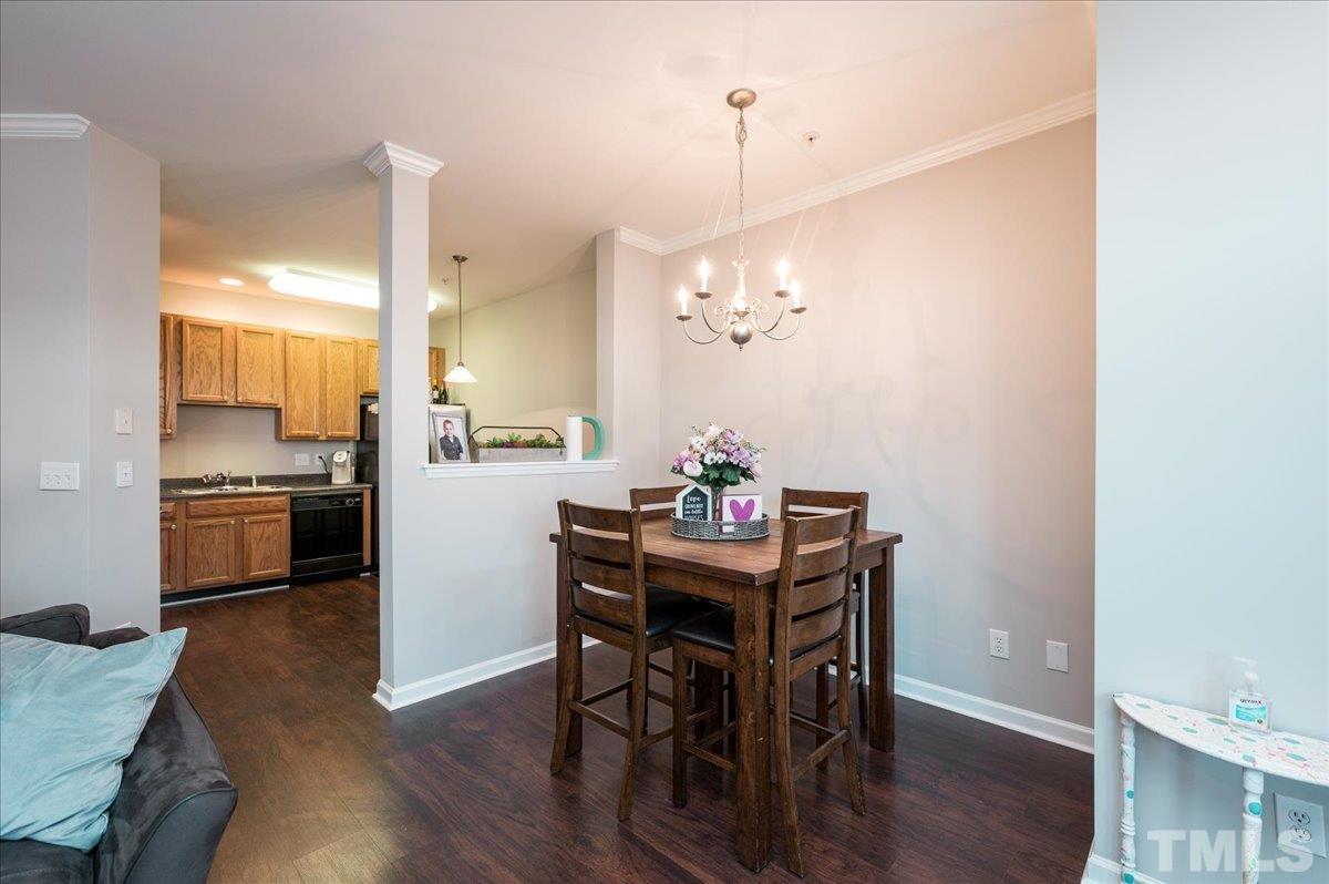 2210 Raven Road, Unit 108 Raleigh, NC 27614 - Photo 8 of 22 a kitchen with a table and chairs in it