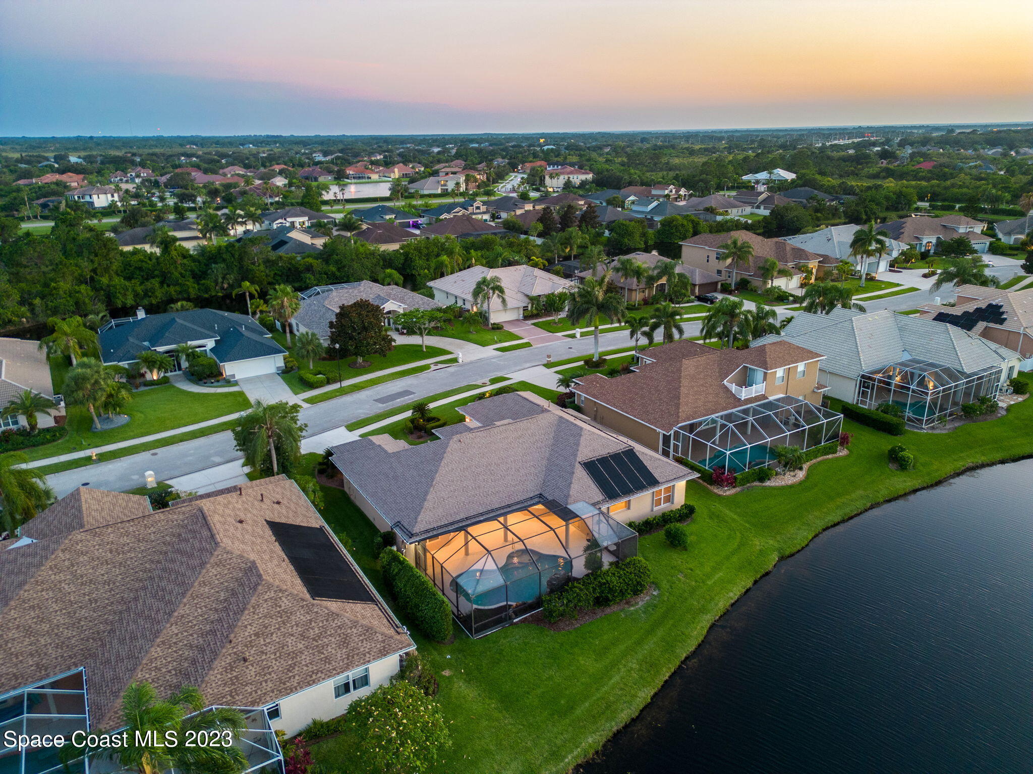 4301 Stoney Point Road Melbourne, FL 32940 - Photo 4 of 99 an aerial view of a house with garden space and street view
