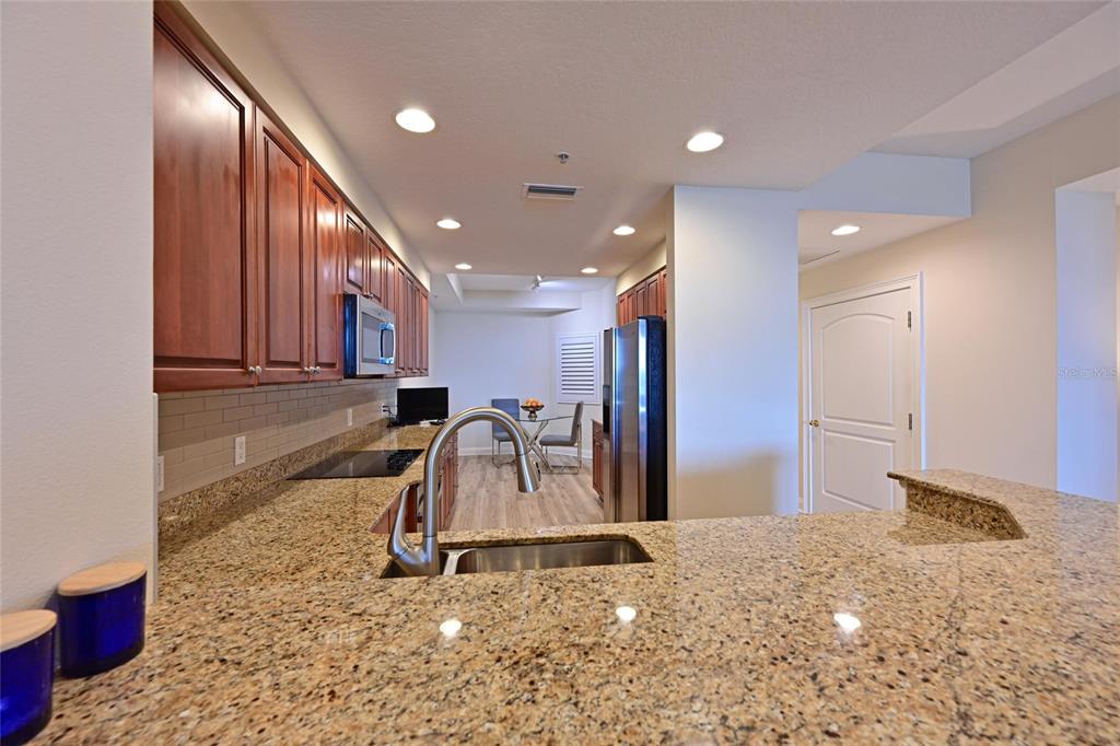 615 Riviera Dunes Way, Unit 107 Palmetto, FL 34221 - Photo 17 of 50 a view of a hallway with a room