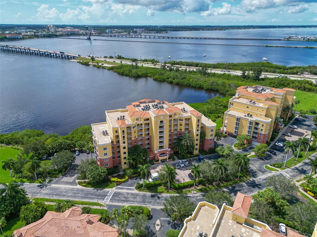 615 Riviera Dunes Way, Unit 107 Palmetto, FL 34221 - Photo 2 of 50 a view of a water with a building in the background