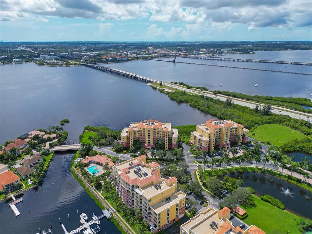 615 Riviera Dunes Way, Unit 107 Palmetto, FL 34221 - Photo 3 of 50 an aerial view of a house with a lake view