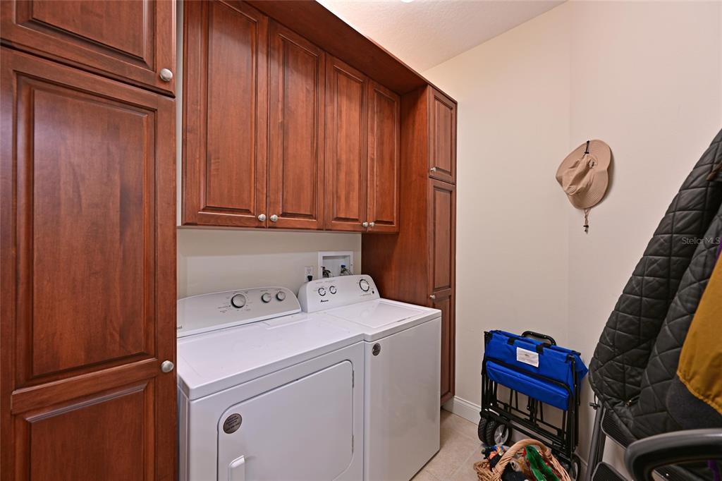 615 Riviera Dunes Way, Unit 107 Palmetto, FL 34221 - Photo 38 of 50 a utility room with dryer and washer
