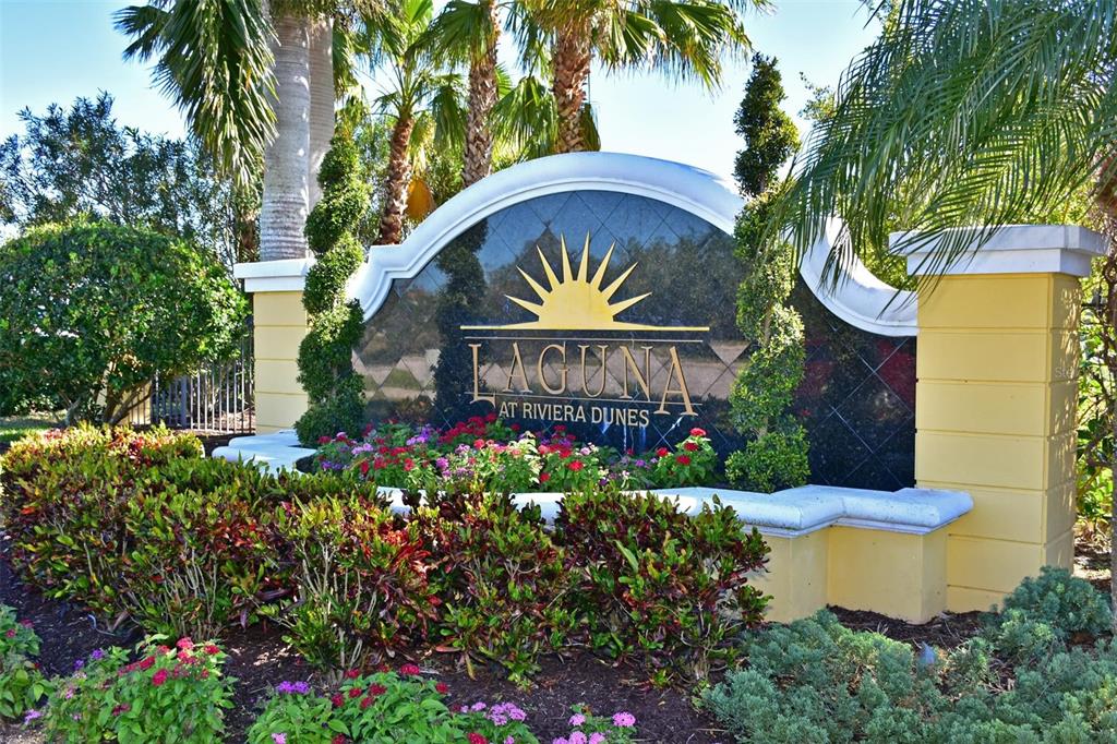 615 Riviera Dunes Way, Unit 107 Palmetto, FL 34221 - Photo 40 of 50 a view of a flower in a garden