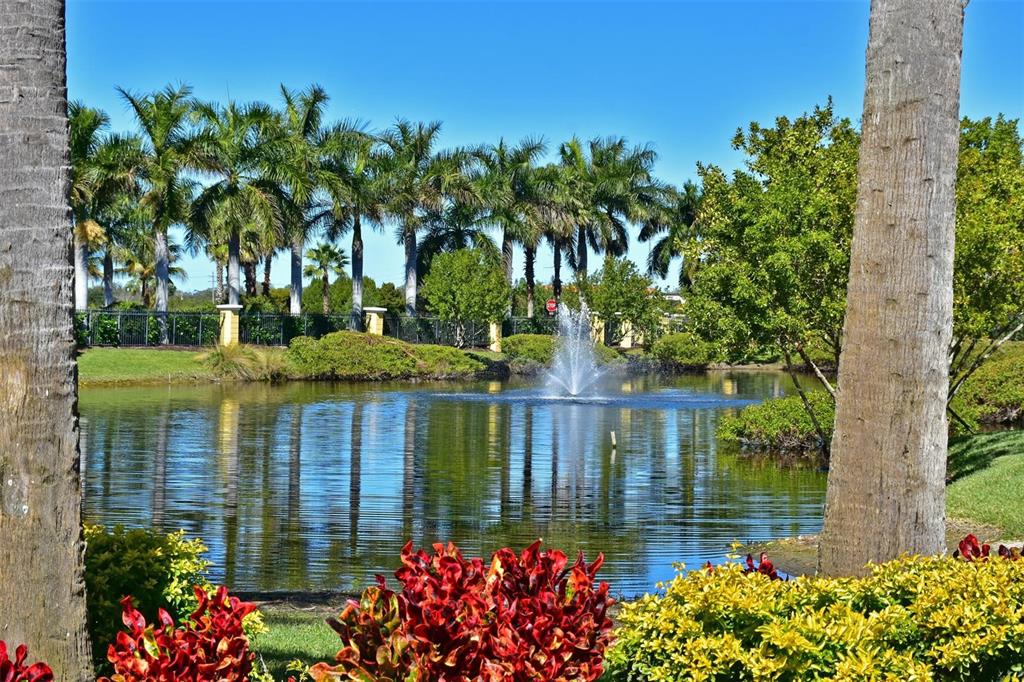615 Riviera Dunes Way, Unit 107 Palmetto, FL 34221 - Photo 41 of 50 a view of a garden with a flower garden