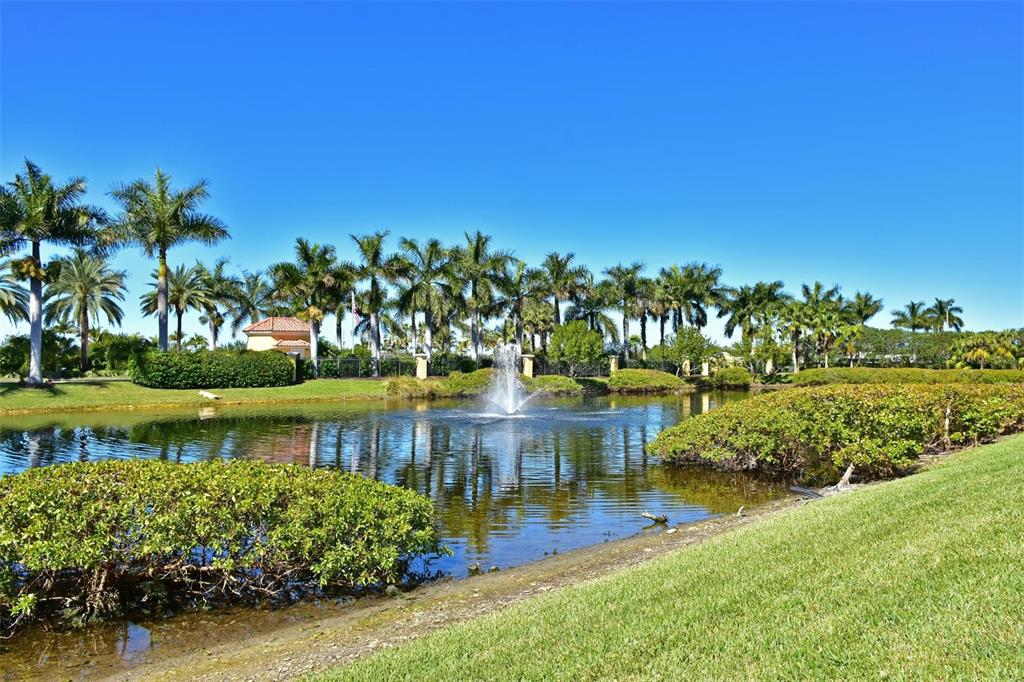 615 Riviera Dunes Way, Unit 107 Palmetto, FL 34221 - Photo 43 of 50 a view of a lake with a house in the background