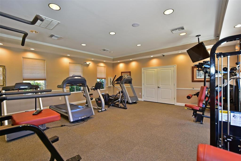 615 Riviera Dunes Way, Unit 107 Palmetto, FL 34221 - Photo 44 of 50 a view of a room with gym equipment