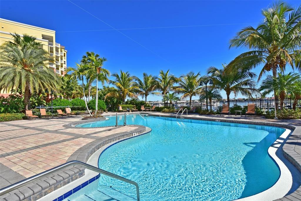 615 Riviera Dunes Way, Unit 107 Palmetto, FL 34221 - Photo 46 of 50 a view of outdoor space with swimming pool and patio