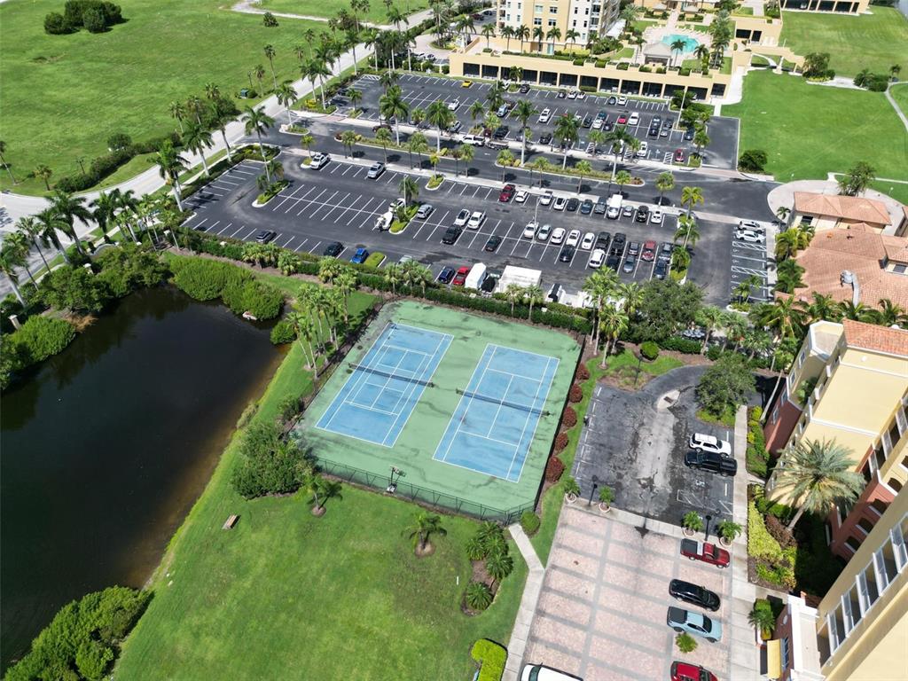 615 Riviera Dunes Way, Unit 107 Palmetto, FL 34221 - Photo 49 of 50 an aerial view of a house with a garden