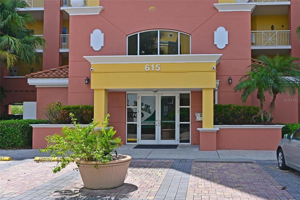 615 Riviera Dunes Way, Unit 107 Palmetto, FL 34221 - Photo 8 of 50 a front view of a multi story residential apartment building
