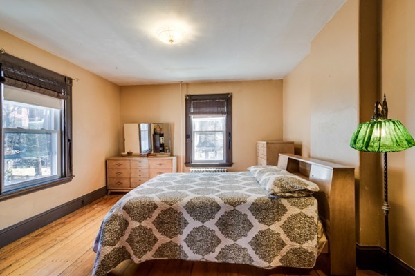 94 Rockview Street Boston, MA 02130 - Photo 14 of 24 a bedroom with a bed and a window