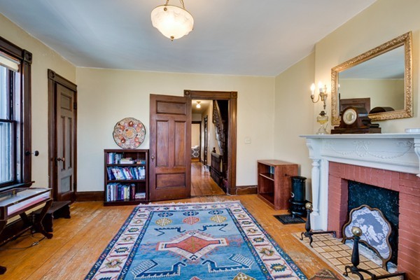 94 Rockview Street Boston, MA 02130 - Photo 15 of 24 a bedroom with furniture and a fireplace