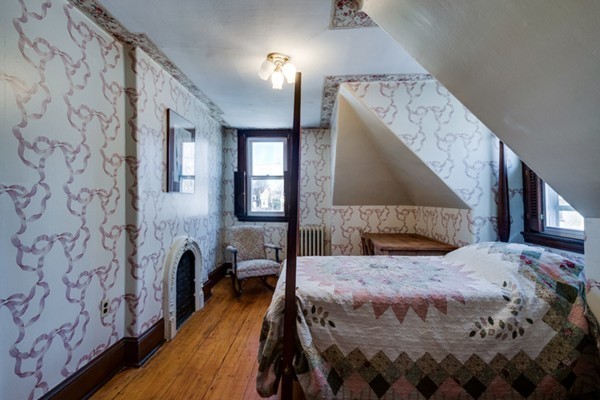 94 Rockview Street Boston, MA 02130 - Photo 19 of 24 a bedroom with a bed and wooden floor