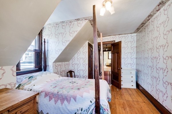 94 Rockview Street Boston, MA 02130 - Photo 20 of 24 a view of a livingroom with furniture and staircase