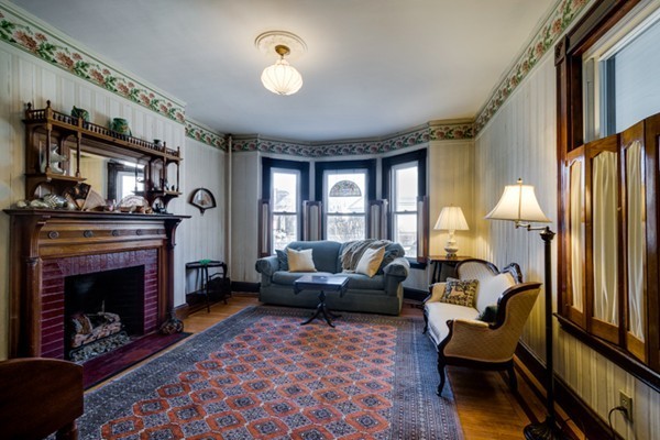 94 Rockview Street Boston, MA 02130 - Photo 6 of 24 a living room with furniture and a fireplace