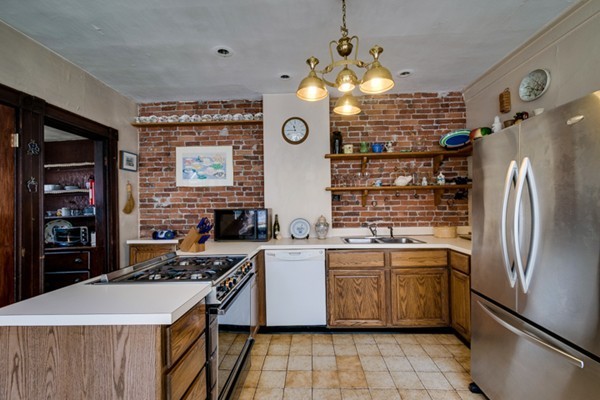 94 Rockview Street Boston, MA 02130 - Photo 9 of 24 a kitchen with stainless steel appliances granite countertop a stove and a refrigerator