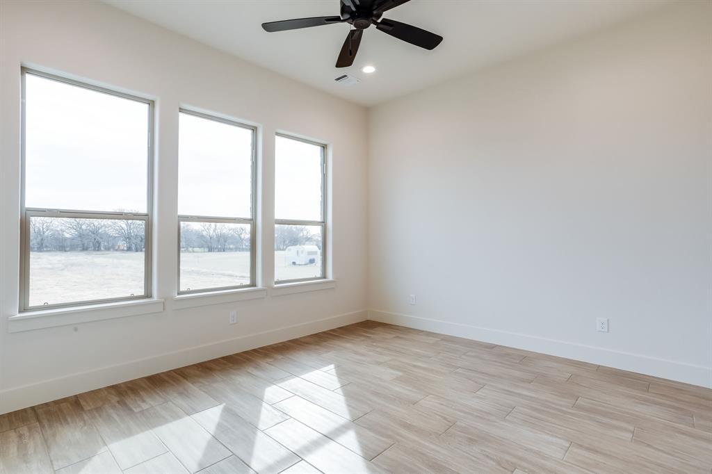 128 Prairie Winds Drive Poolville, TX 76487 - Photo 26 of 40 a view of an empty room with a window